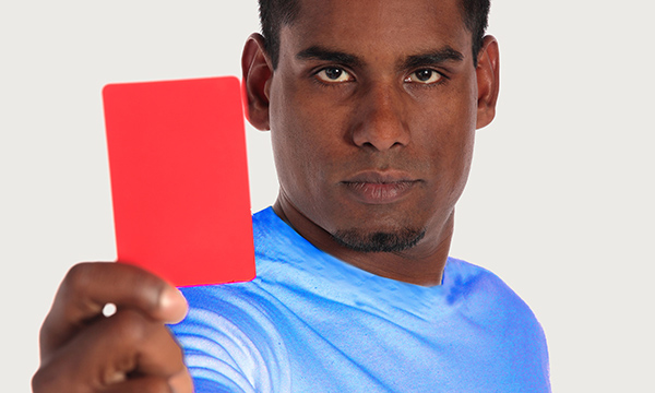 Man holding red card up
