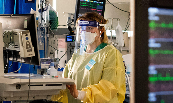 Nurse working in ICU in full PPE. Referring to nursing as a ‘calling’ fails to recognise it as a highly skilled profession