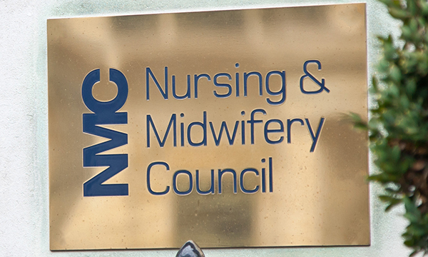 Brass name plate at entrance to NMC