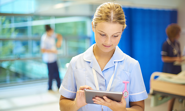 nurse refers to tablet computer