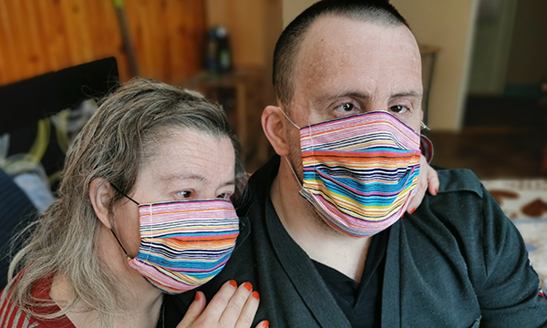 Picture shows a couple with Down's syndrome weating face masks. A&nbsp;nurse academic says figures on of learning disability deaths from COVID-19 are needed now to help prevent unnecessary deaths