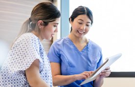 A nurse talks to a patient about their care plan
