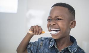 Boy brushing his teeth