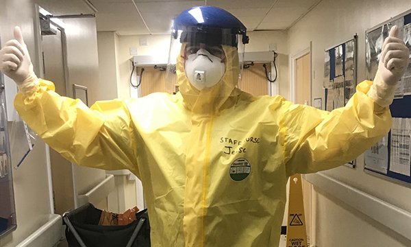 Newly qualified nurse Jesse Boxall-Steeden wearing PPE in a critical care unit
