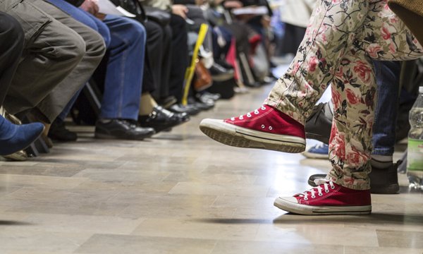 Emergency department waiting room full of people