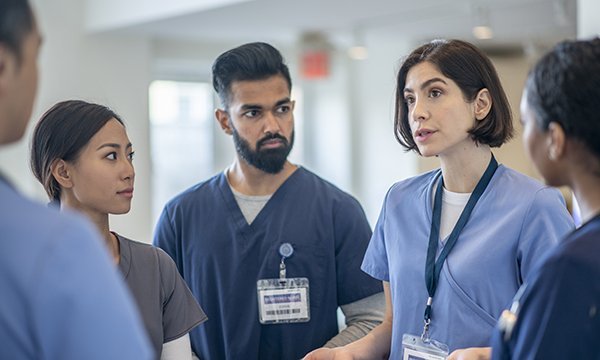 A group of nurses holding a discussion