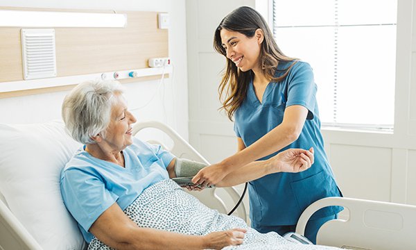 Differentiation of nursing roles: a nursing associate with a patient