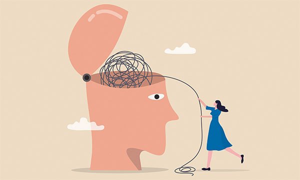 Illustration showing a gigantic open head containing a ball of black string that is being unravelled by a nurse who is standing to one side of the head
