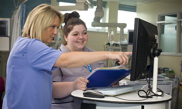 Cut to placement hours: nurse with student on ward