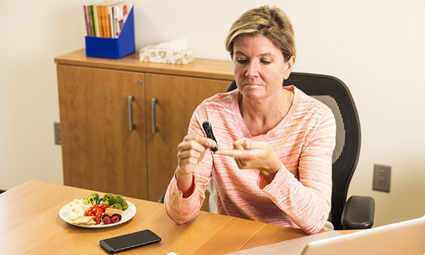Woman self-administers pin prick test