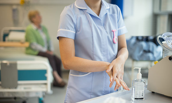 nurse washes her hands